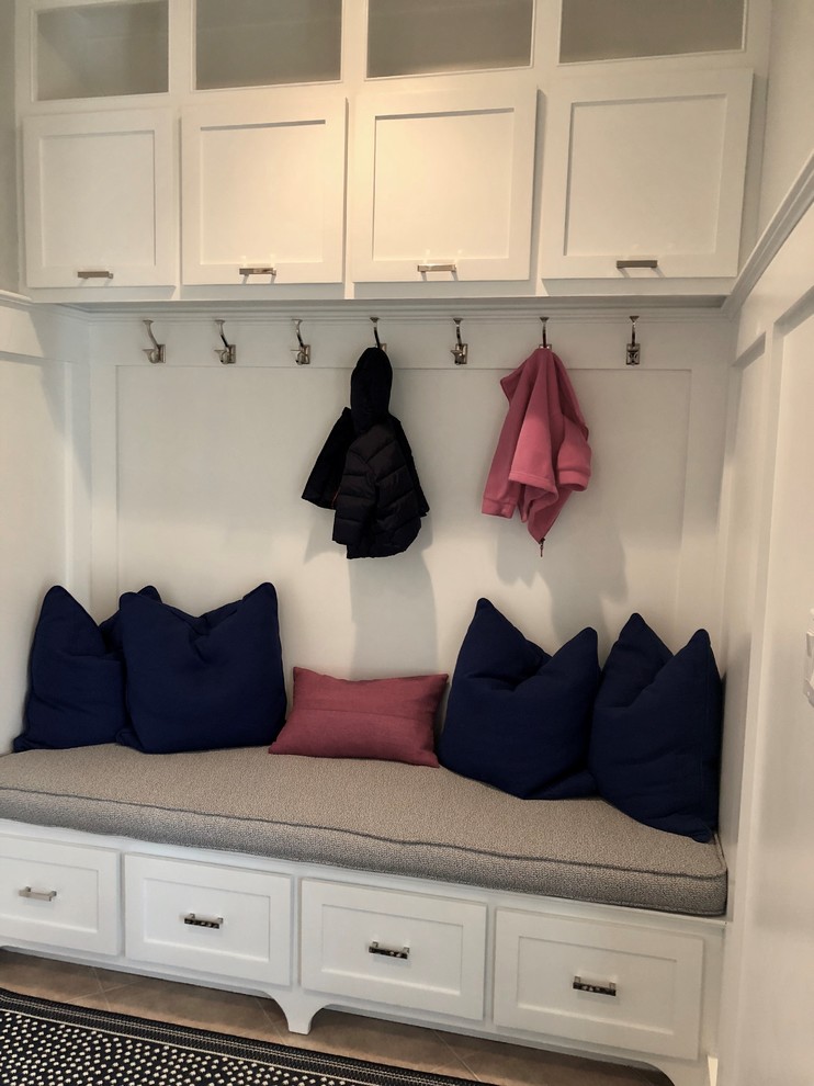 Inspiration for a mid-sized transitional porcelain tile and beige floor mudroom remodel in Boston with gray walls
