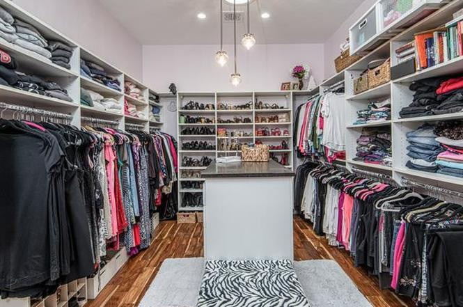 Large mountain style women's dark wood floor dressing room photo