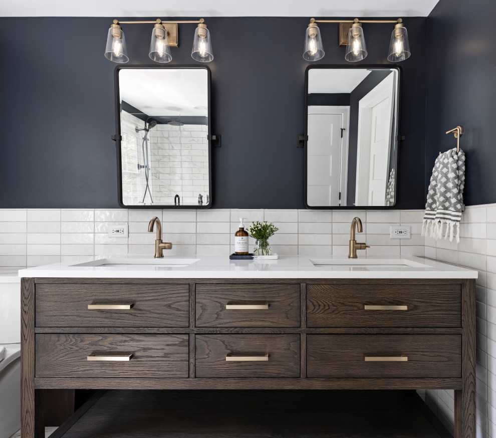 Inspiration for a mid-sized transitional master white floor and double-sink bathroom remodel in Detroit with brown cabinets, a hinged shower door, white countertops and a niche