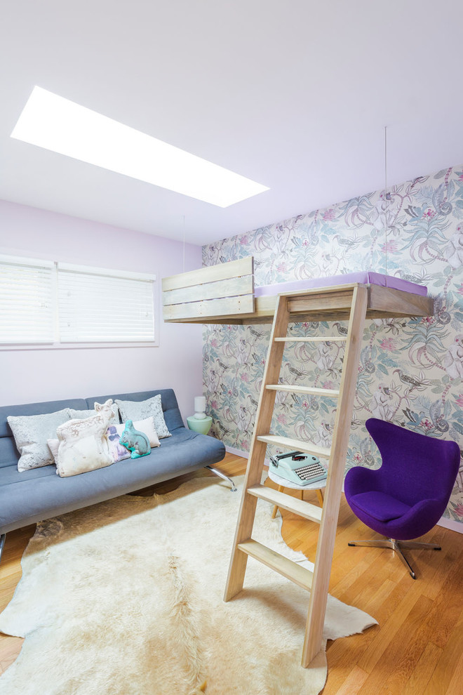 Design ideas for a mid-sized midcentury kids' bedroom for kids 4-10 years old and girls in Portland with light hardwood floors, purple walls and beige floor.