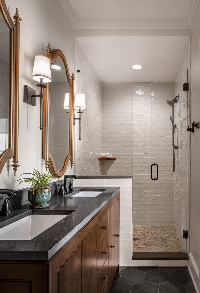 Photo of a large transitional master wet room bathroom in Atlanta with furniture-like cabinets, dark wood cabinets, a one-piece toilet, white tile, subway tile, beige walls, ceramic floors, an undermount sink, engineered quartz benchtops, grey floor, a hinged shower door and grey benchtops.