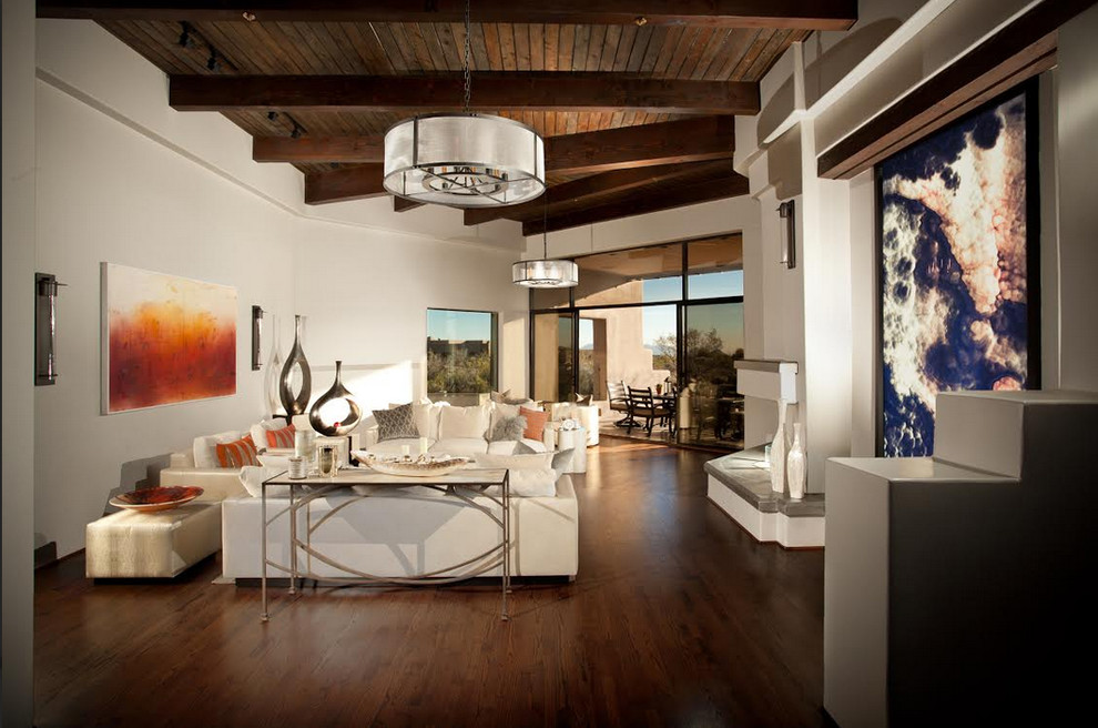 Photo of a modern living room in Phoenix with white walls and dark hardwood floors.