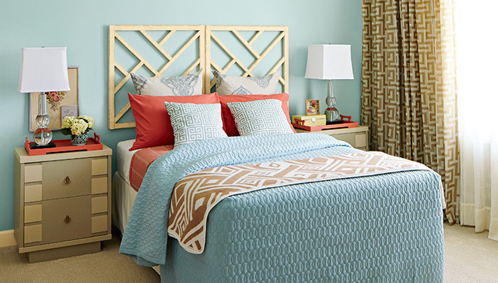 Inspiration for a large transitional master bedroom in Charlotte with blue walls and carpet.