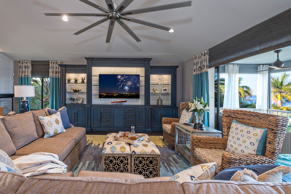 Mid-sized beach style open concept living room in Miami with grey walls, dark hardwood floors, no fireplace and a wall-mounted tv.