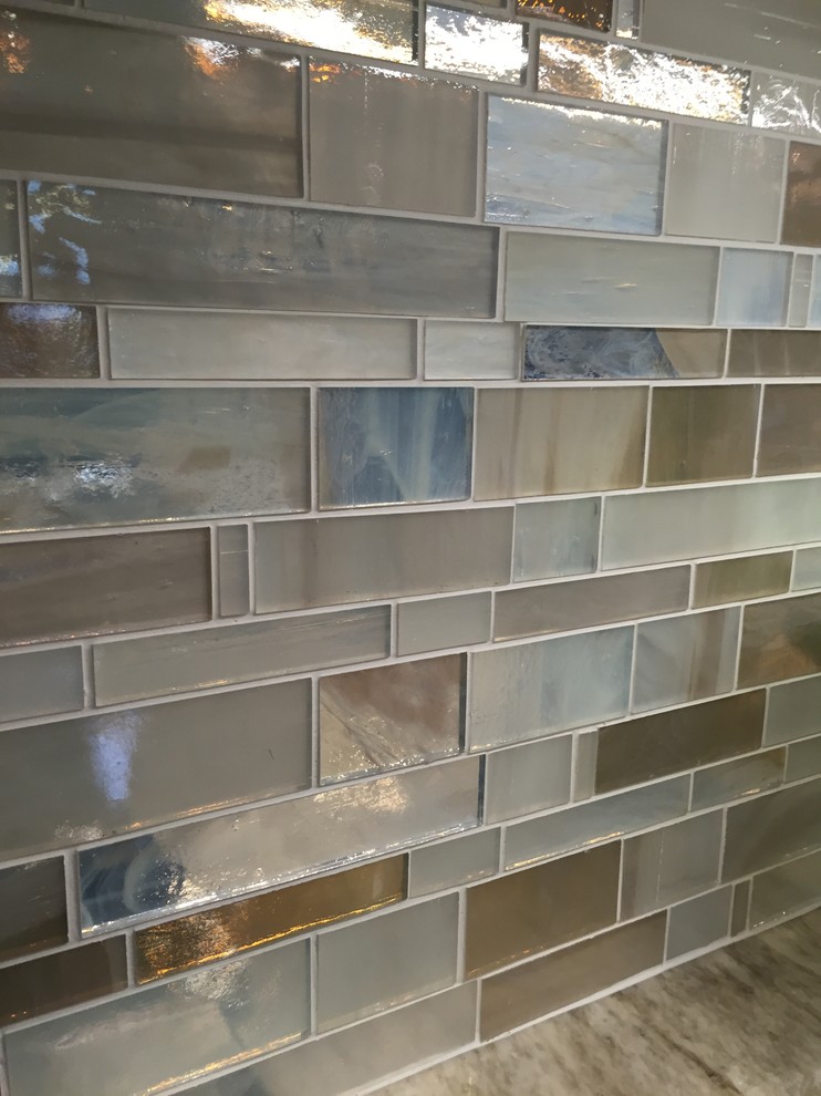 Transitional ceramic tile kitchen photo with a single-bowl sink, dark wood cabinets, multicolored backsplash, mosaic tile backsplash, stainless steel appliances and an island
