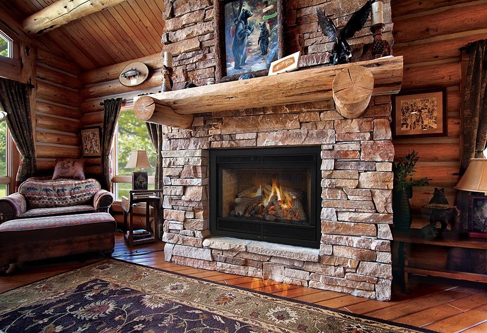 Inspiration for a mid-sized country open concept family room in Denver with beige walls, medium hardwood floors, a standard fireplace, a stone fireplace surround and no tv.