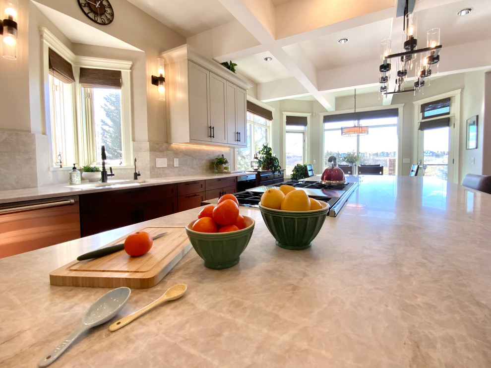 Eat-in kitchen - large transitional single-wall dark wood floor, brown floor and coffered ceiling eat-in kitchen idea in Calgary with an undermount sink, shaker cabinets, quartzite countertops, white backsplash, stainless steel appliances, an island, white countertops and white cabinets