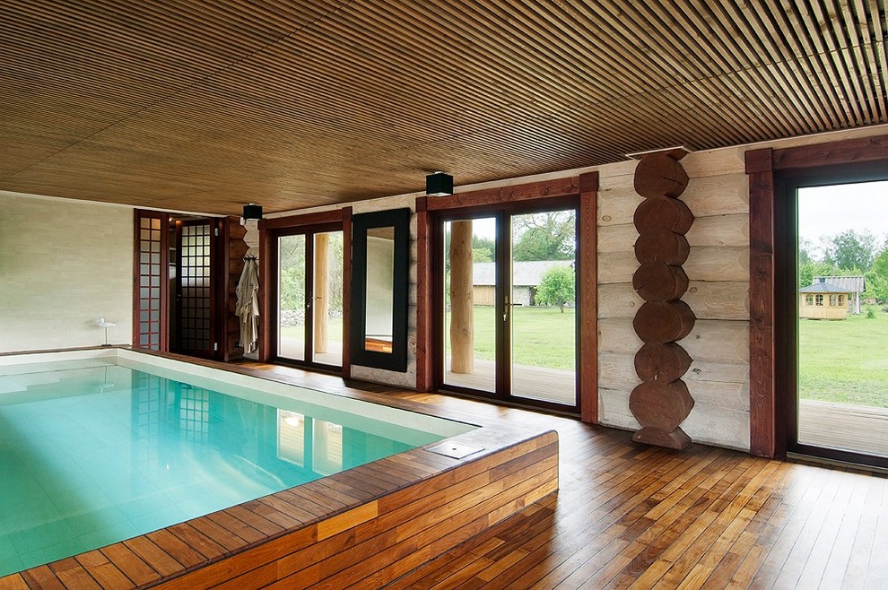 This is an example of an expansive scandinavian rectangular pool in Toronto with a pool house.