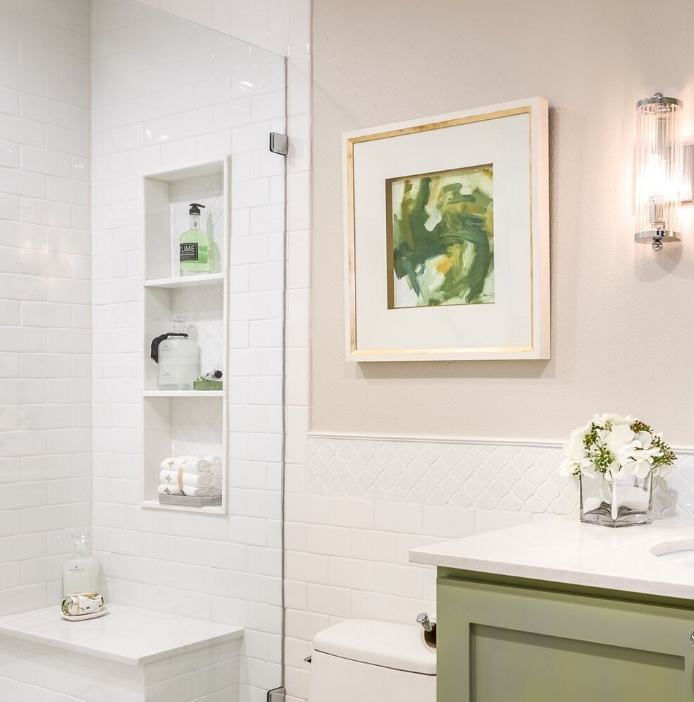 Mid-sized traditional 3/4 bathroom in Houston with shaker cabinets, green cabinets, an open shower, a one-piece toilet, beige tile, ceramic tile, beige walls, porcelain floors, an undermount sink, engineered quartz benchtops, beige floor and a hinged shower door.