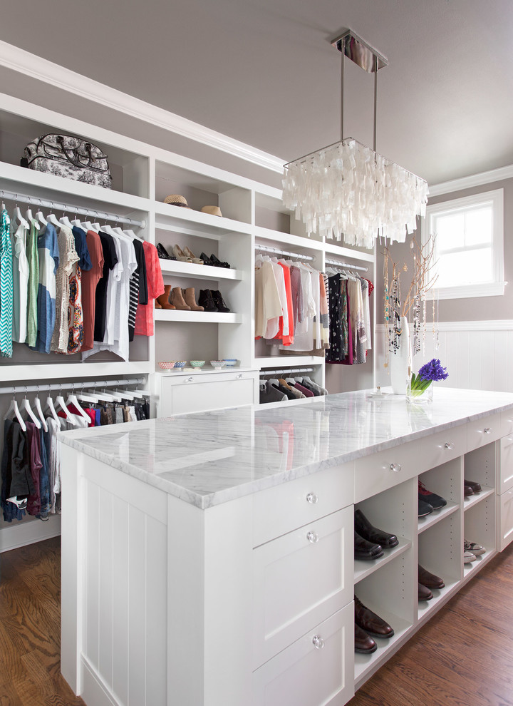 Mid-sized transitional gender-neutral medium tone wood floor dressing room photo in Austin with shaker cabinets and white cabinets