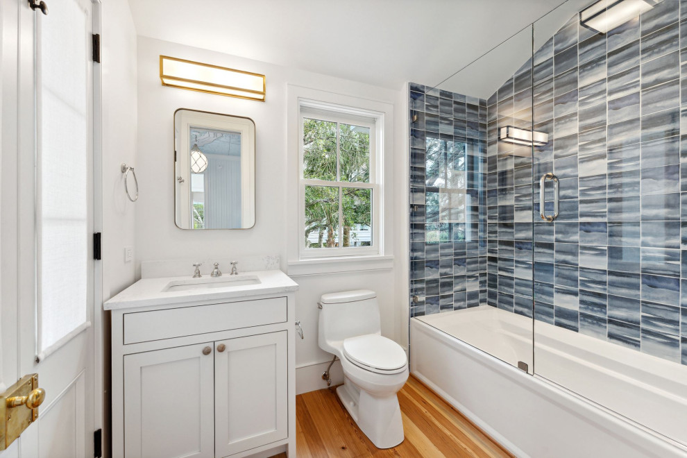 Historic Sea Cabins - Nothing short of fun in this kid's bathroom featuring a water-like blue tile that mimics the ocean waves outside.