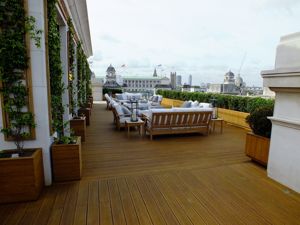 This is an example of a traditional rooftop full sun garden in London with decking.