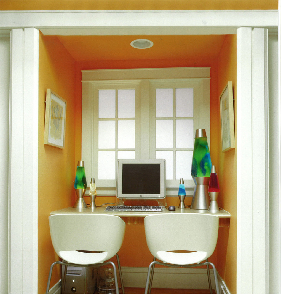 This is an example of a contemporary kids' room in Chicago with orange walls.
