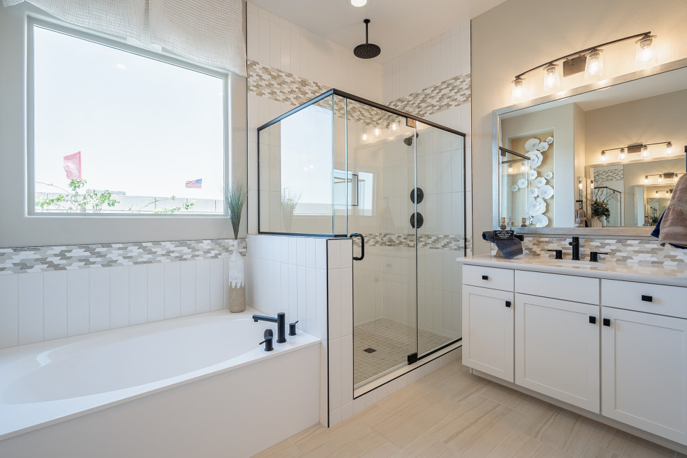 Inspiration for a mid-sized contemporary master bathroom in Phoenix with recessed-panel cabinets, beige cabinets, a corner tub, a corner shower, beige tile, ceramic tile, beige walls, light hardwood floors, an undermount sink, solid surface benchtops, beige floor, a hinged shower door and beige benchtops.