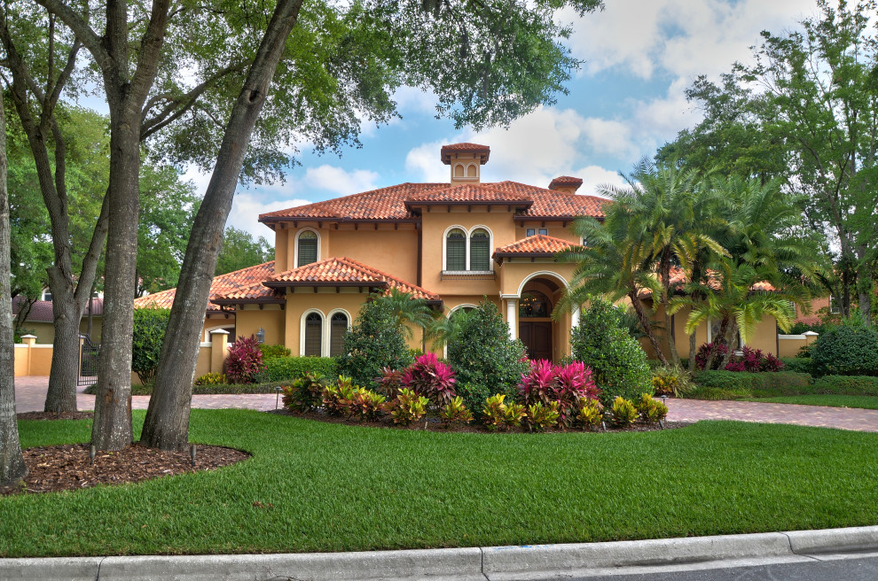 Design ideas for a large mediterranean exterior in Tampa.