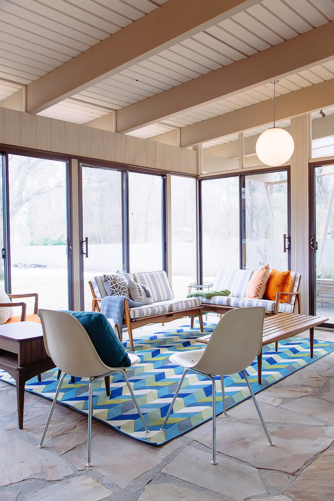 Midcentury sunroom in Grand Rapids with slate floors and a standard ceiling.