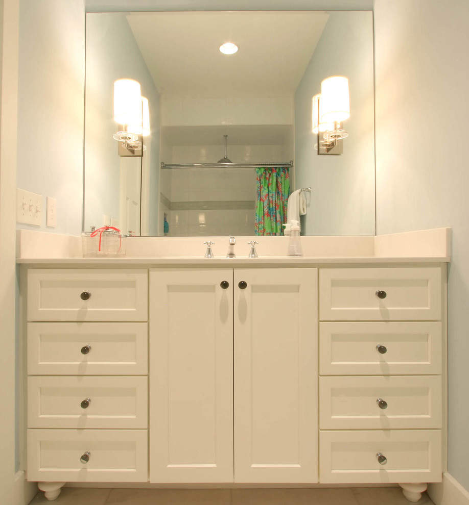 Design ideas for a small transitional kids bathroom in Charlotte with flat-panel cabinets, white cabinets and a shower/bathtub combo.