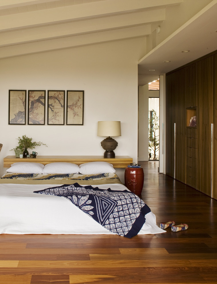 Midcentury master bedroom in Orange County with orange floor.