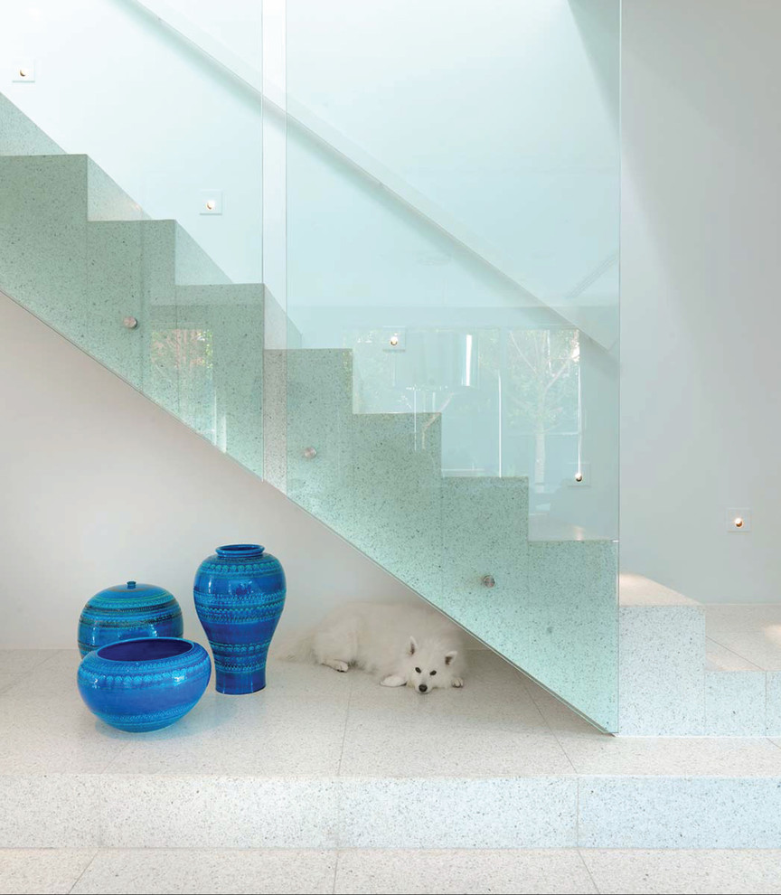 This is an example of a large contemporary tile floating staircase in Melbourne.