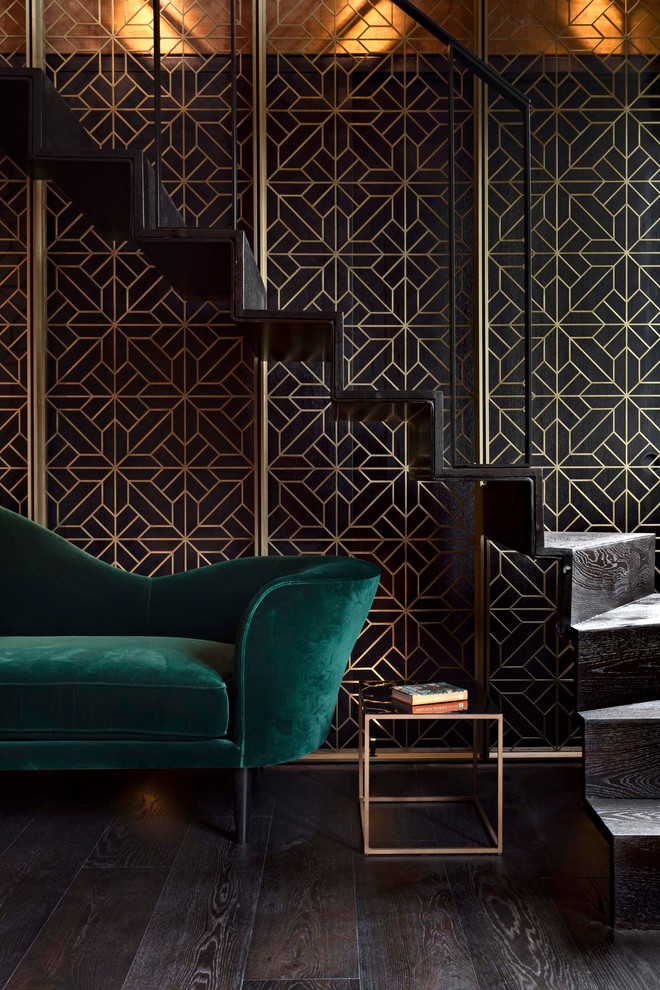 Inspiration for a contemporary wood l-shaped metal railing staircase in London with wood risers.