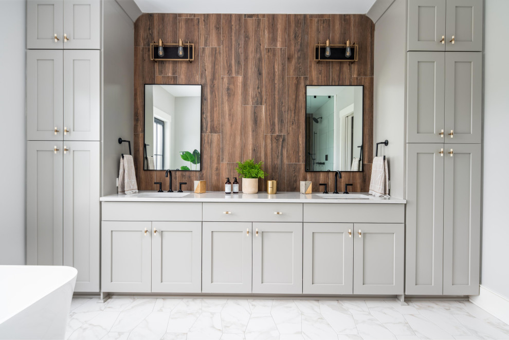 Design ideas for a beach style master bathroom in Charleston with grey cabinets, white floor, white benchtops, a double vanity, a built-in vanity, shaker cabinets, brown tile and wood-look tile.