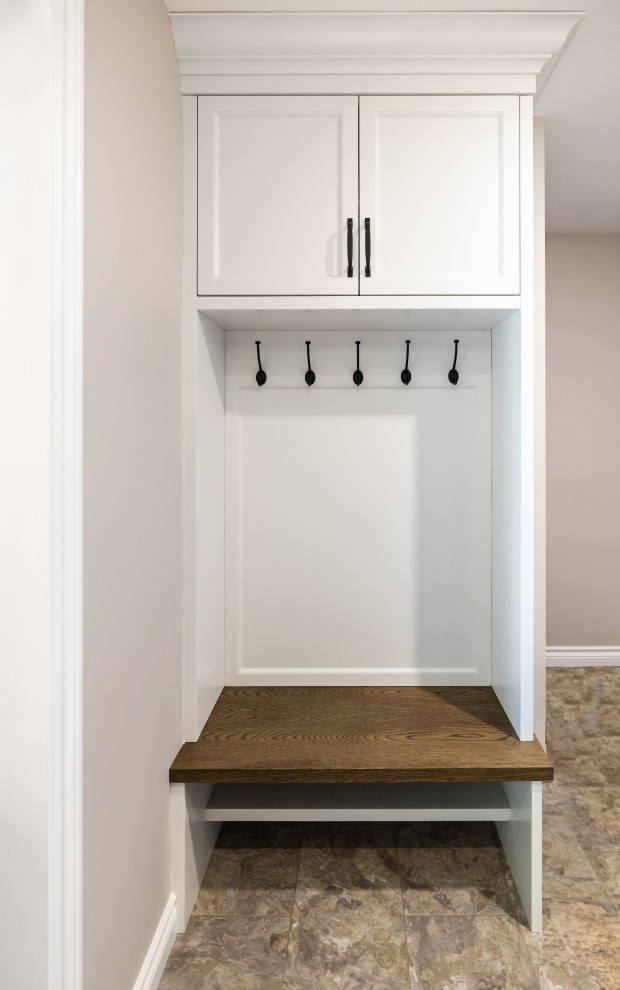 Small transitional vinyl floor and gray floor mudroom photo in Toronto with white walls