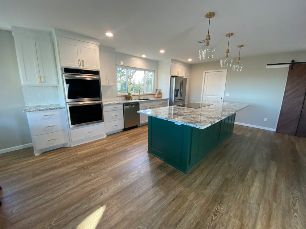 Large contemporary galley eat-in kitchen in Other with laminate floors and with island.