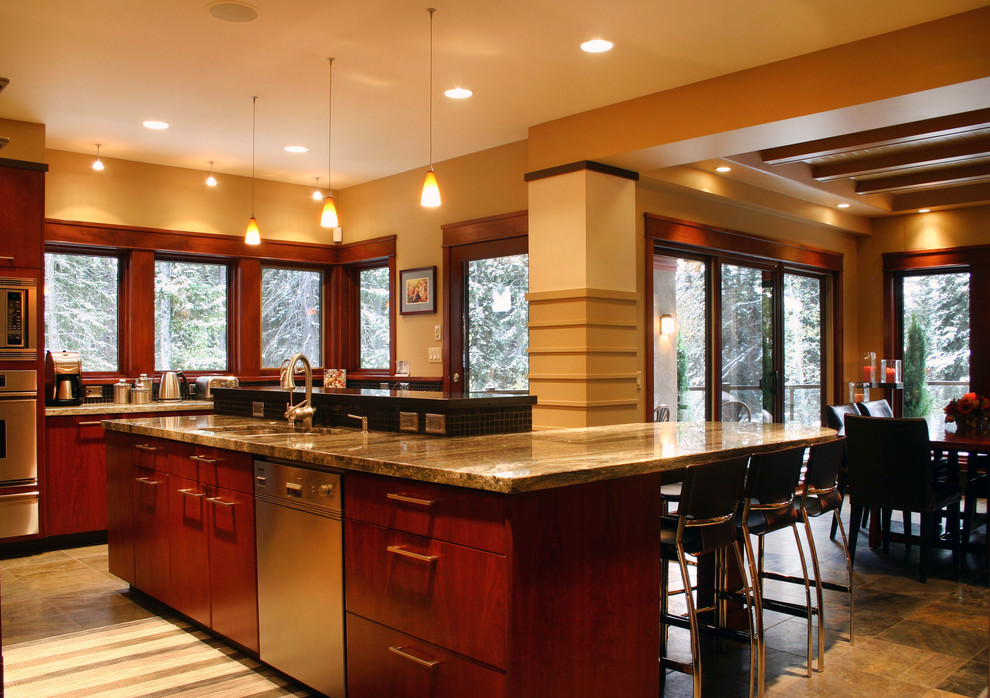 Inspiration for a mid-sized transitional u-shaped ceramic tile and beige floor eat-in kitchen remodel in Calgary with a double-bowl sink, flat-panel cabinets, dark wood cabinets, granite countertops, black backsplash, mosaic tile backsplash, stainless steel appliances and an island