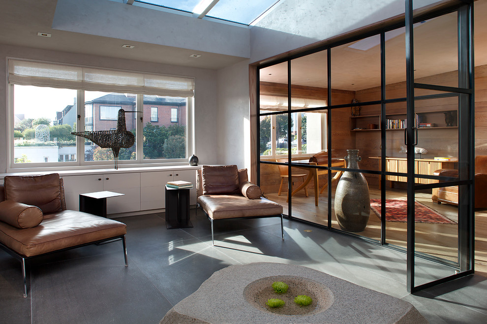 This is an example of a contemporary sunroom in San Francisco with concrete floors and grey floor.