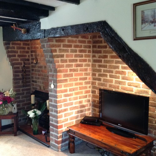 How to lighten a cottage with small windows and black wooden beams