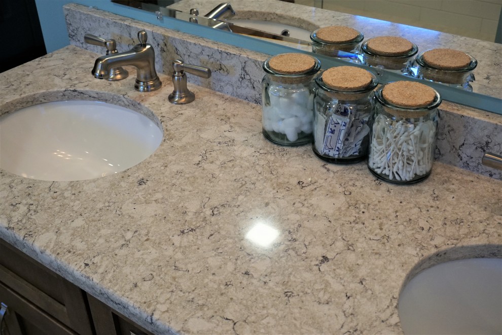 Example of a mid-sized transitional master white tile and subway tile porcelain tile and beige floor home design design in Providence with recessed-panel cabinets, brown cabinets, blue walls, an undermount sink, quartz countertops and multicolored countertops