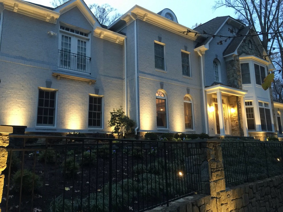 This is an example of a large traditional two-storey brick white exterior in DC Metro.