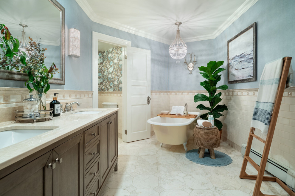 Inspiration for a coastal bathroom in New York with shaker cabinets, dark wood cabinets, a claw-foot bath, beige tiles, metro tiles, blue walls, beige floors, beige worktops, double sinks and a freestanding vanity unit.