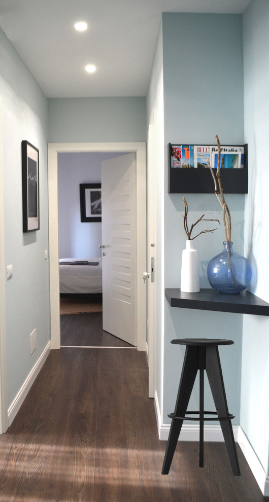 This is an example of a contemporary entryway in Other with laminate floors.