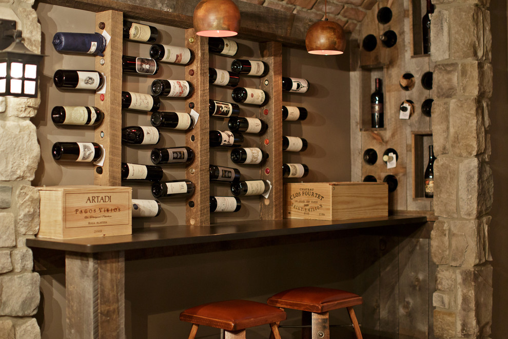 This is an example of a mediterranean wine cellar in Philadelphia with storage racks.