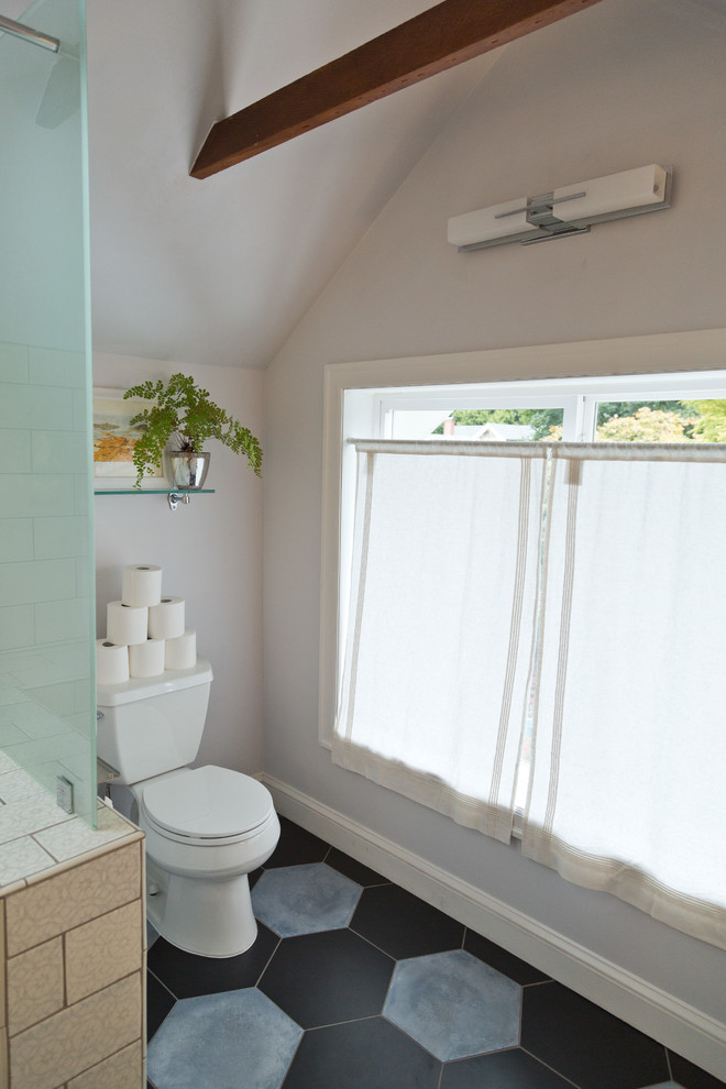 This is an example of a small eclectic master bathroom in Portland with recessed-panel cabinets, white cabinets, an alcove tub, a shower/bathtub combo, a two-piece toilet, white tile, ceramic tile, white walls, ceramic floors, a drop-in sink, engineered quartz benchtops, multi-coloured floor and a shower curtain.
