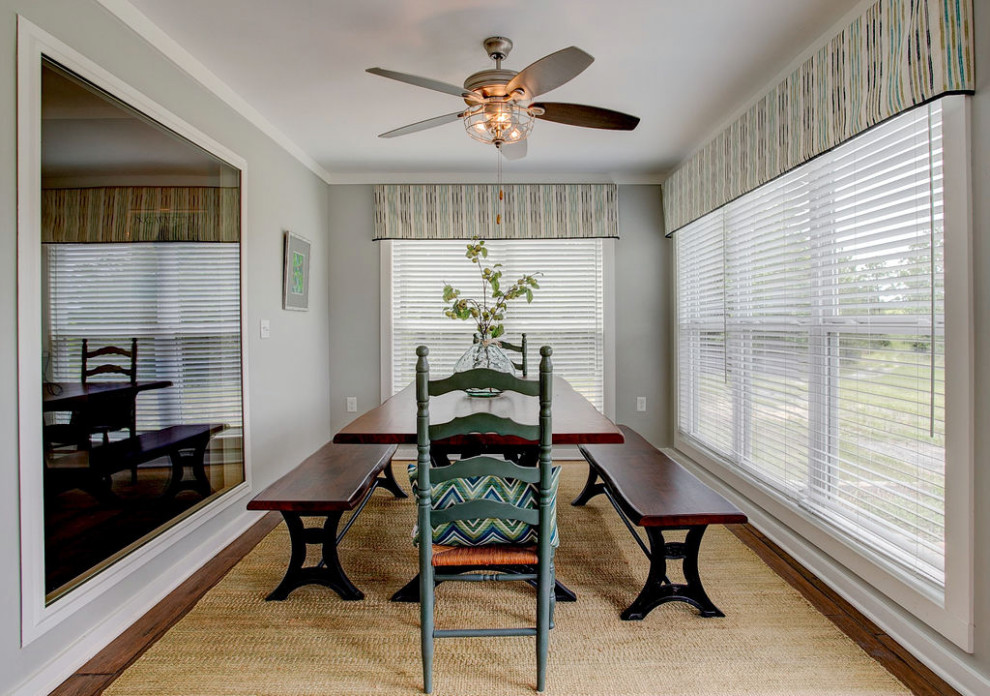 Example of a mid-sized farmhouse porcelain tile and brown floor sunroom design in Other