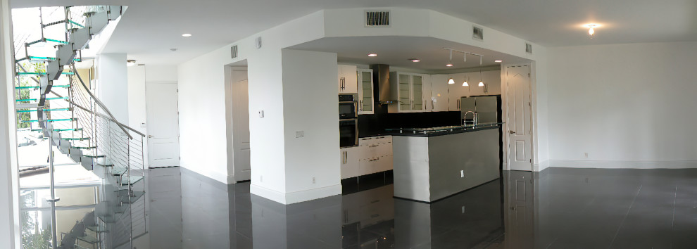 Photo of a large contemporary open concept living room in Miami with porcelain floors and black floor.