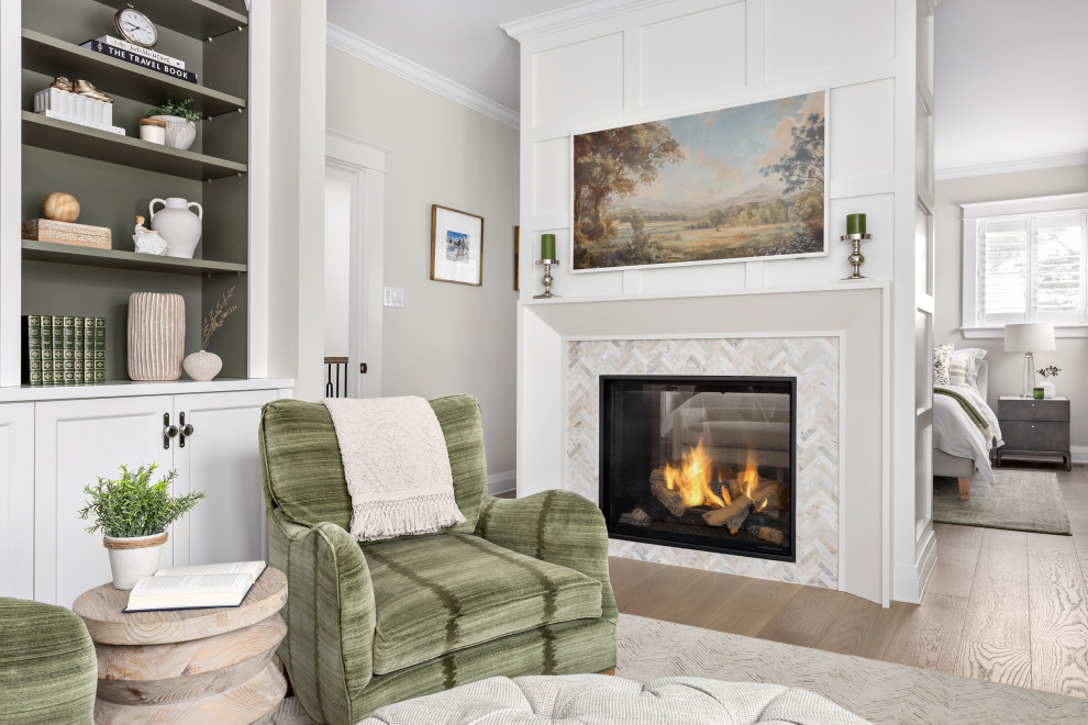 Bedroom - large transitional master medium tone wood floor and wall paneling bedroom idea in Other with beige walls, a two-sided fireplace and a tile fireplace