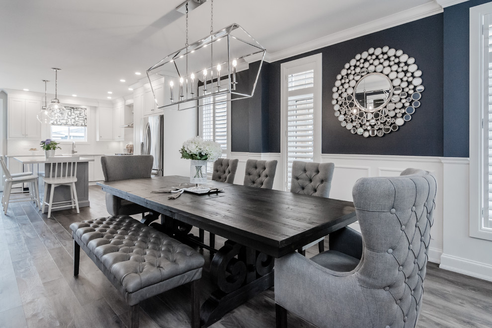 Photo of a transitional dining room in Toronto with blue walls, dark hardwood floors and grey floor.
