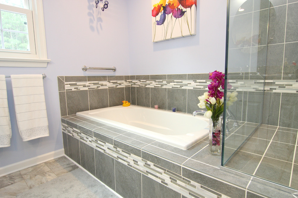 Design ideas for a mid-sized transitional master bathroom in Other with an undermount sink, raised-panel cabinets, white cabinets, marble benchtops, a drop-in tub, an open shower, a two-piece toilet, gray tile, porcelain tile, purple walls and linoleum floors.