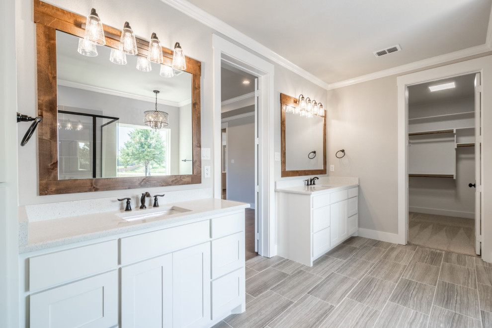 Country master bathroom in Dallas with white cabinets, a drop-in tub, a corner shower, beige walls, porcelain floors, an undermount sink, engineered quartz benchtops, a hinged shower door, white benchtops, a shower seat, a double vanity and a built-in vanity.