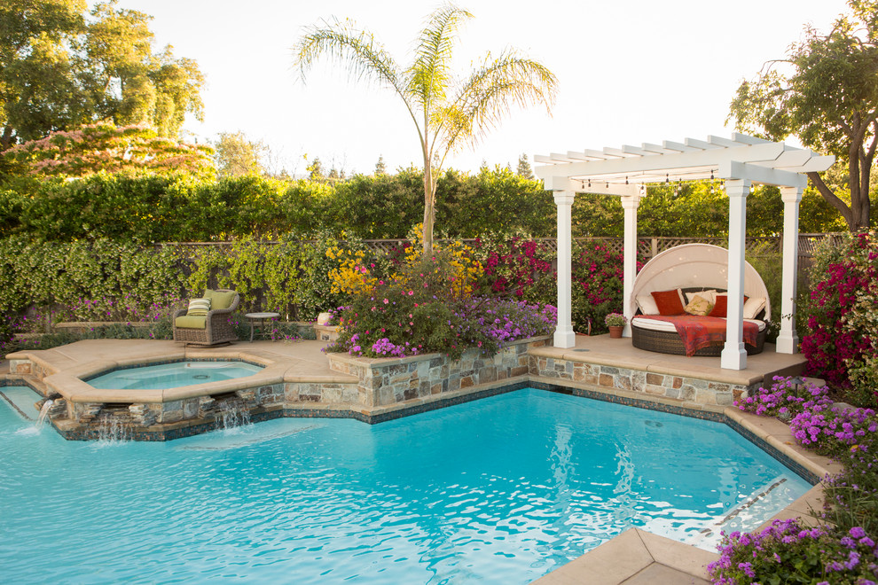 Design ideas for a large traditional backyard custom-shaped pool in San Francisco with natural stone pavers.