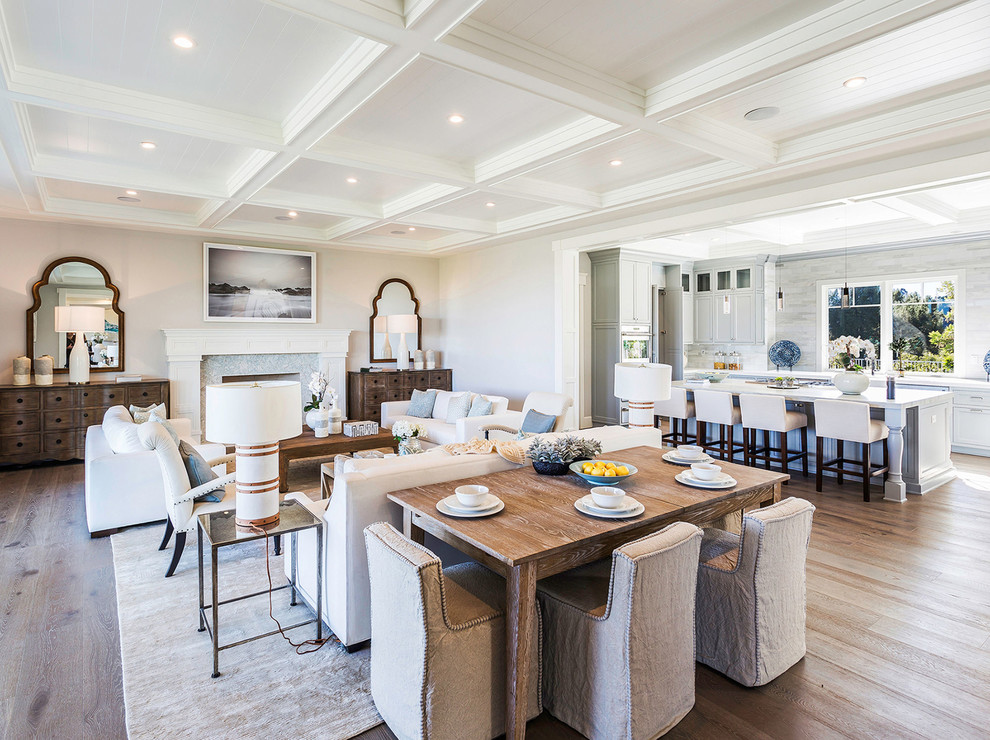 Inspiration for a transitional light wood floor and beige floor great room remodel in Miami with gray walls, a standard fireplace and a stone fireplace