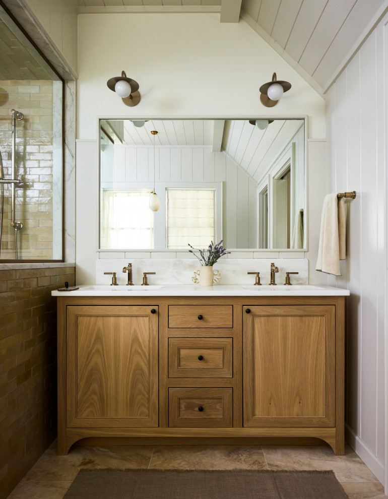 Large transitional master beige tile travertine floor, beige floor, double-sink, vaulted ceiling and wall paneling freestanding bathtub photo with beaded inset cabinets, medium tone wood cabinets, a one-piece toilet, beige walls, an undermount sink, quartzite countertops, a hinged shower door, white countertops and a freestanding vanity