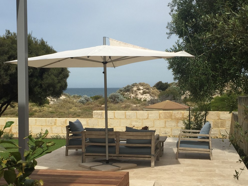 This is an example of a large beach style patio in Perth.
