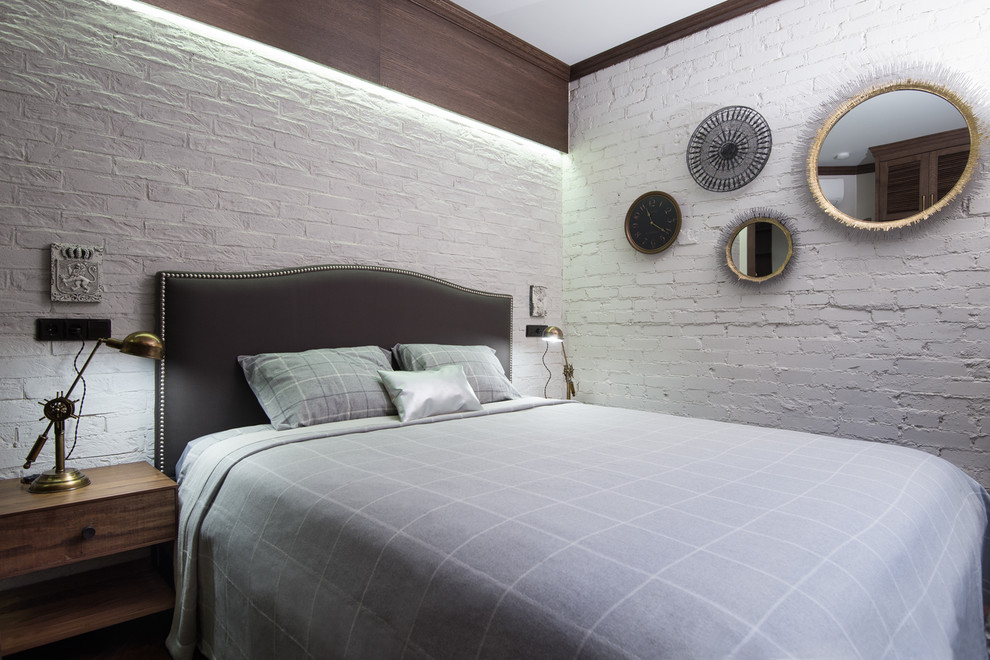 This is an example of a contemporary master bedroom in Moscow with white walls.