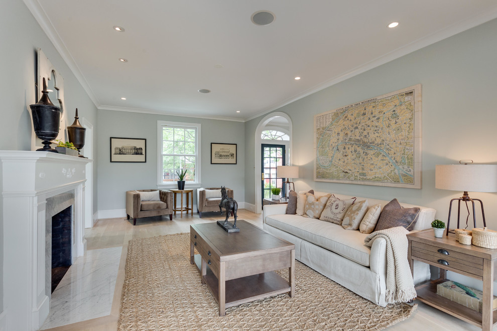 Mid-sized traditional enclosed living room in DC Metro with grey walls, light hardwood floors, a standard fireplace and a stone fireplace surround.