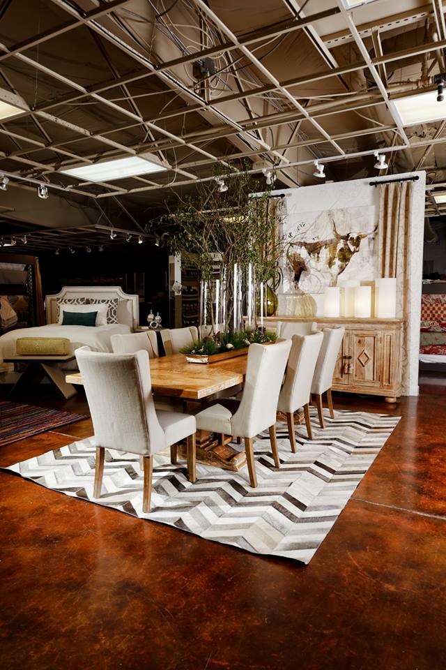 This is an example of a country dining room in Other with white walls.
