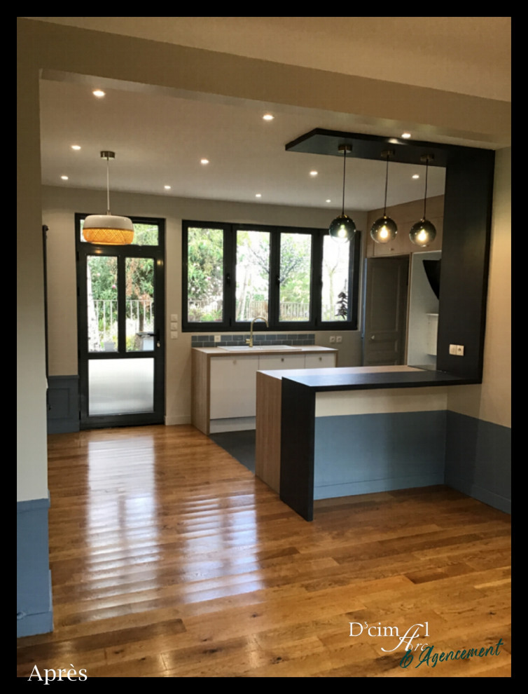 This is an example of a mid-sized scandinavian u-shaped open plan kitchen in Other with a double-bowl sink, flat-panel cabinets, white cabinets, laminate benchtops, blue splashback, porcelain splashback, white appliances, ceramic floors, a peninsula, black floor and brown benchtop.